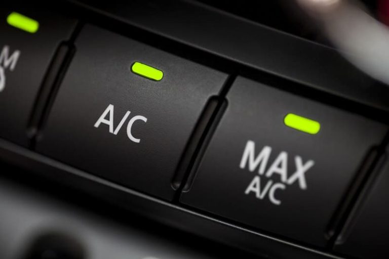 Air conditioning and MAX A/C controls on a car centre console