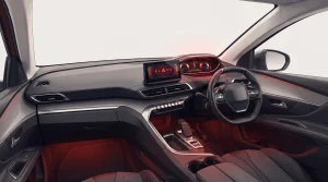 Right-hand-drive Peugeot 3008 i-Cockpit interior showing a digital driver display with a warning indication lit, instead of analogue dials