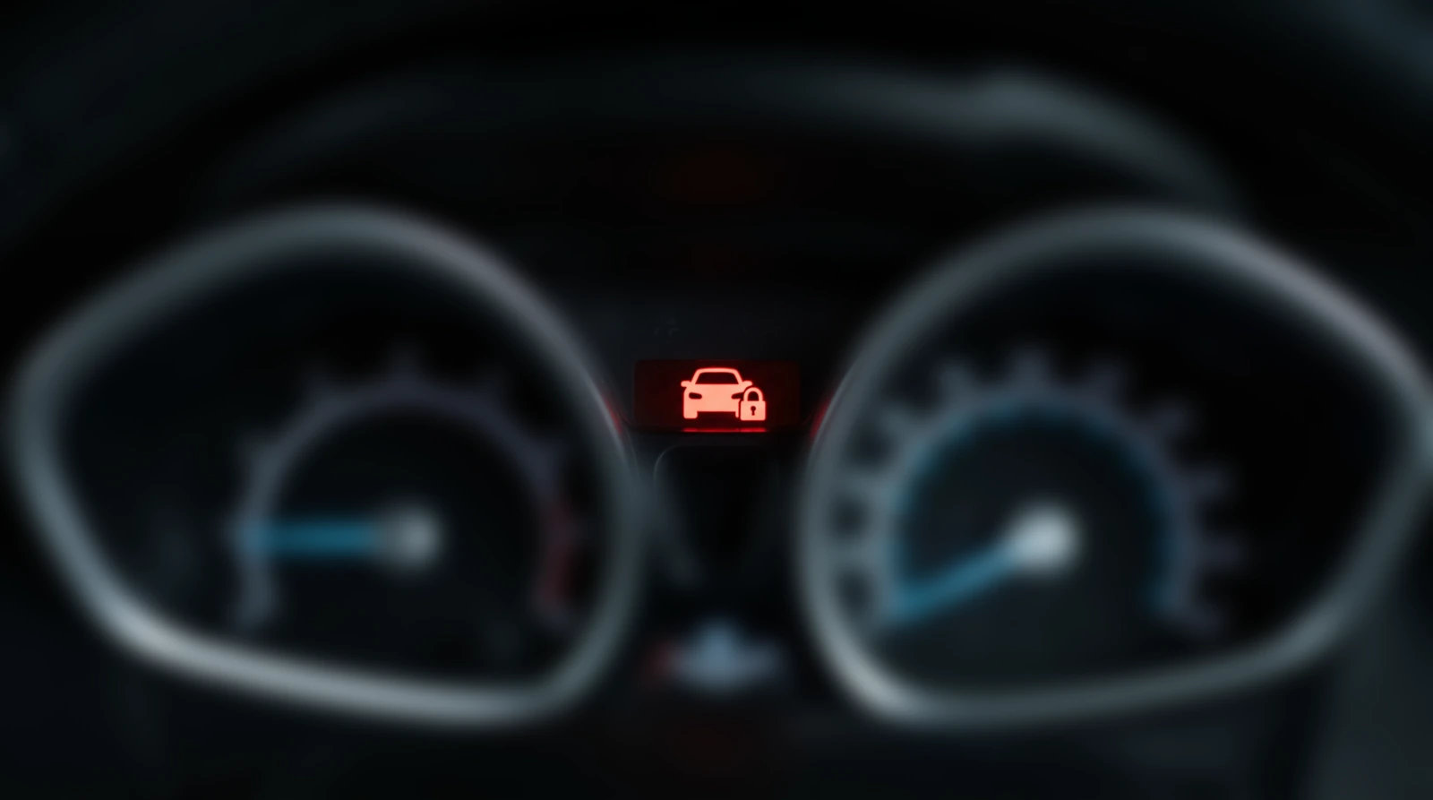 Ford PATS security light showing a red car and padlock between the rev counter and speedometer